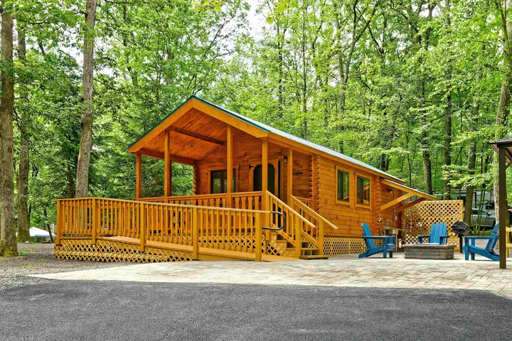 A rental cabin on its deck in the woods