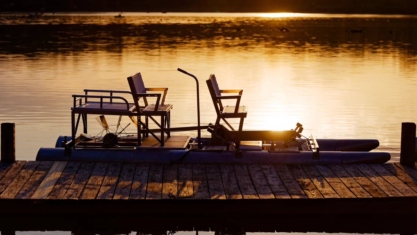 Chairs on the dock at sunset
